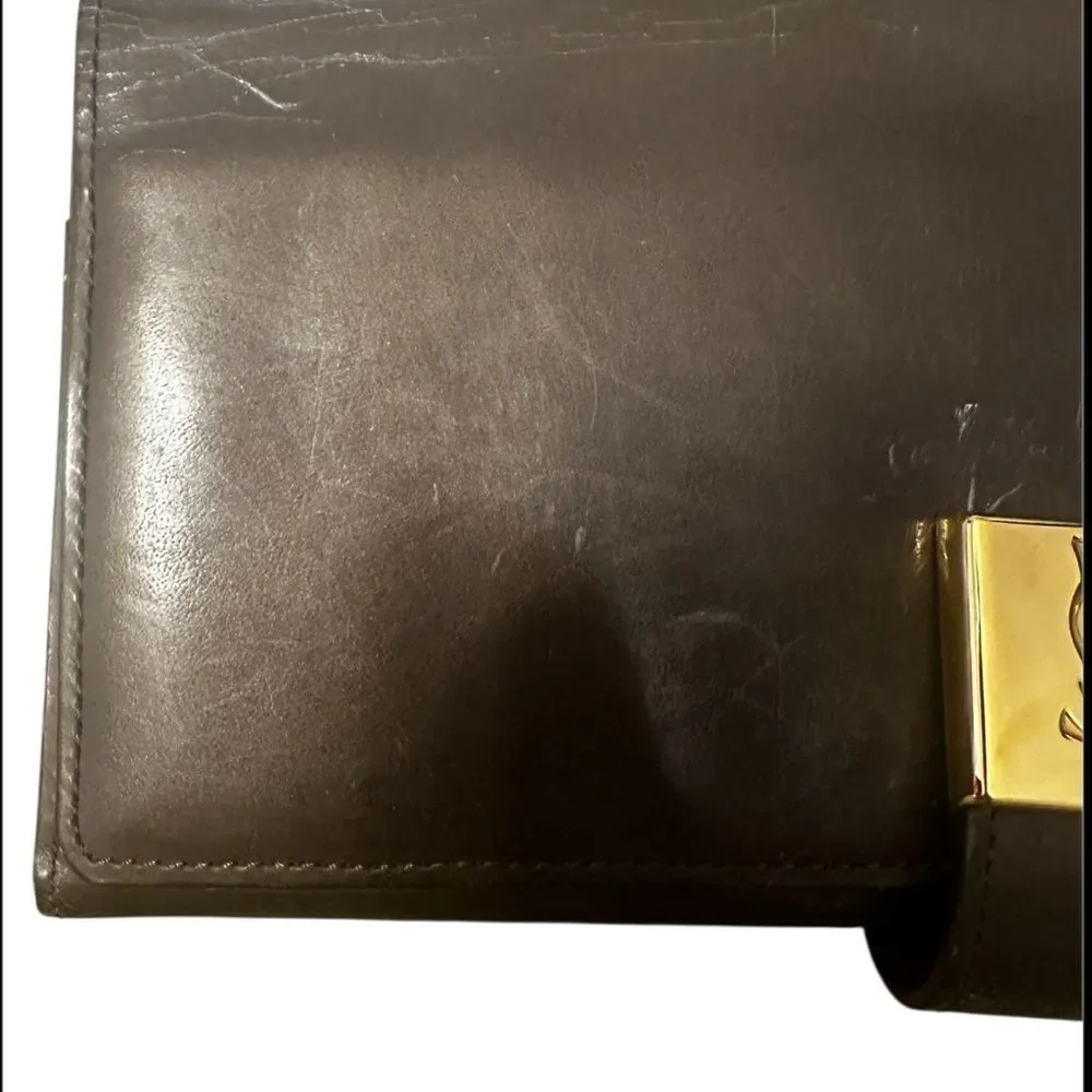 Yves Saint Laurent Tan Leather Wallet with Gold Clasp with marks and scratches.